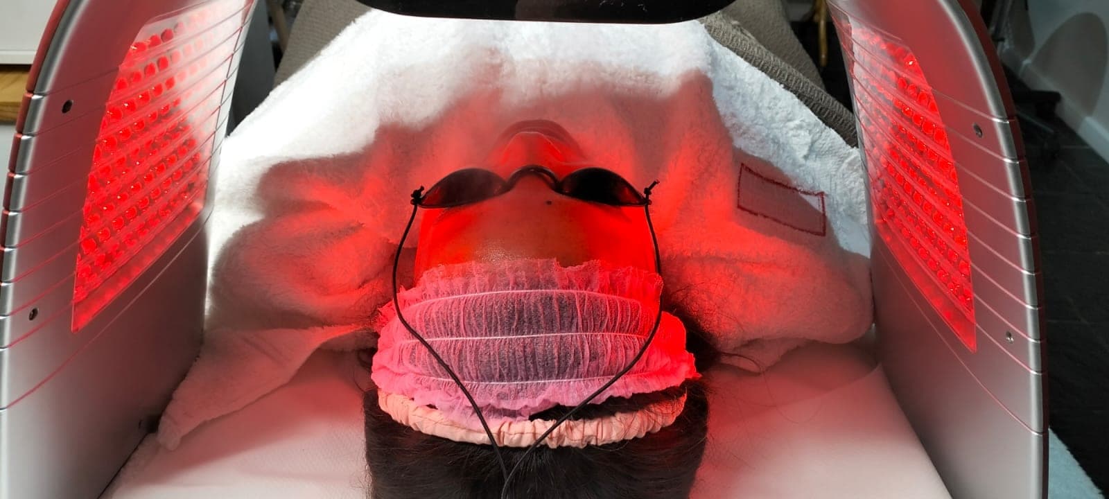 Treatment room at Hope Aesthetics — red light therapy in progress